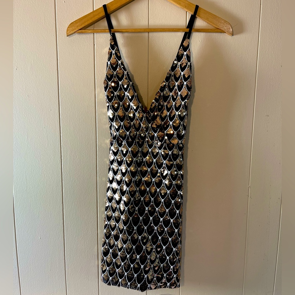 Black and gold sequin dress